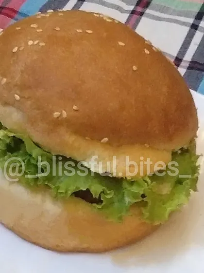 A close-up of my Zinger Burger, highlighting the fresh lettuce and soft bun. It's a simple, satisfying, and juicy chicken burger.