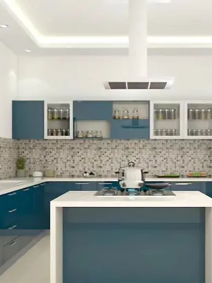 This U-shaped kitchen features glossy blue cabinets and a central island for additional prep space. The mosaic tile backsplash adds texture and visual interest, while the white upper cabinets keep the space feeling bright and open.