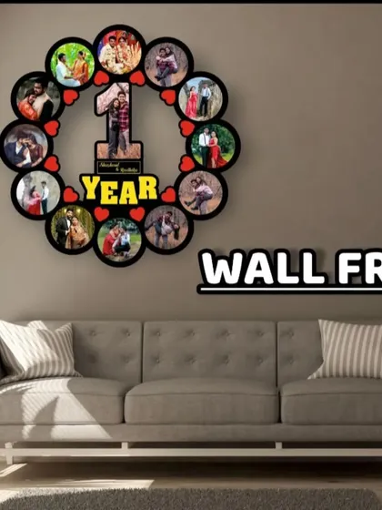 Celebrate a milestone with this '1 Year' anniversary wall frame. It features a large central photo and is surrounded by 12 smaller photos, one for each month of the year.