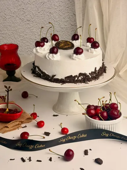 A classic Black Forest Gateau, done the right way. It features layers of rich chocolate sponge, fresh whipped cream, and juicy cherries.