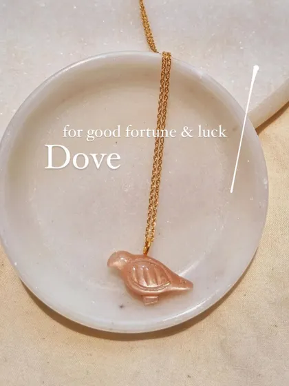 Another view of the Peach Moonstone Dove pendant.