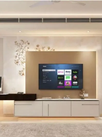 A bedroom featuring a built-in TV unit with an integrated study desk, demonstrating our expertise in multi-functional space planning.