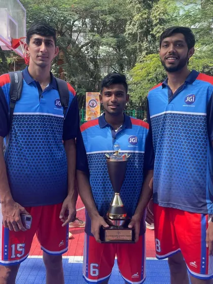 Holding the runner-up trophy with teammates.