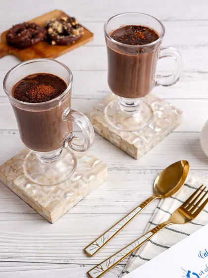 Cozy and comforting hot chocolate, styled for a cafe menu with a bright and airy feel.