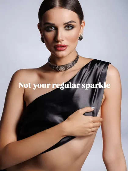 "Not your regular sparkle." This image for a diamond choker set uses minimalist styling with a simple silk drape to ensure the jewellery is the undisputed hero. The direct gaze of the model adds a layer of confidence and allure.