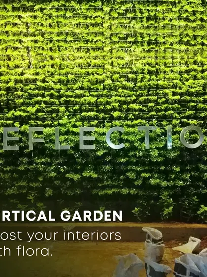 An outdoor vertical garden under construction, showing the scale of what's possible. Once fully grown, this "reflection" wall will become a massive green facade, boosting the building's aesthetic and environmental credentials.