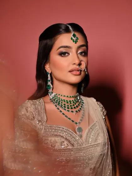 Another beautiful portrait of the 'Moonlit Majesty' look, capturing the intricate details of the jewelry and the soft, radiant finish of the skin.