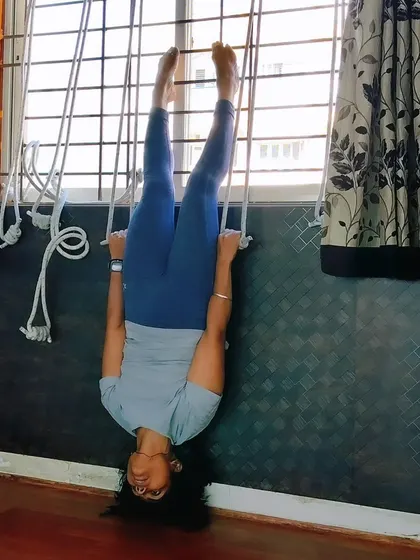 For those ready to explore deeper, I use techniques like rope wall yoga, inspired by Iyengar methods. This inversion, supported by the ropes, helps decompress the spine and improve circulation with a feeling of lightness and freedom.