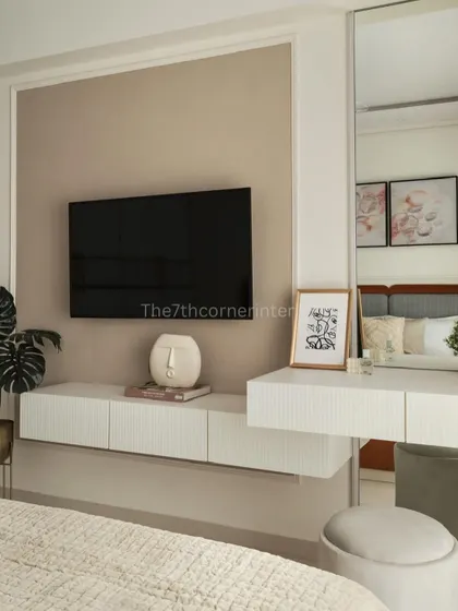 Another view of the integrated TV and vanity unit, showing how the clean, white, fluted design creates a minimalist and modern look while providing essential functionality.
