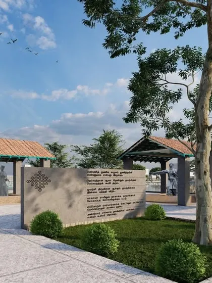 A public plaza area with memorial stones and shaded pavilions, designed as a space for community gathering and reflection.