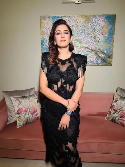 The full look for this milestone birthday. The edgy black dress is paired with a makeup look that is both sophisticated and fun.