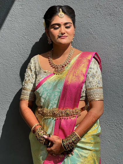 The play of light and shadow in this shot shows how well the makeup holds up in direct sunlight, maintaining a smooth and radiant finish without looking heavy.