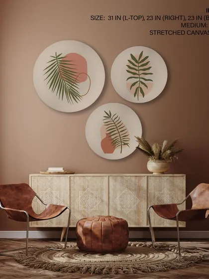 This set of three circular prints features bohemian leaf designs in a warm, earthy palette. The stretched canvas format gives them a clean, modern look that is perfect for a relaxed, contemporary space.