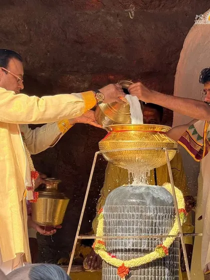 The sacred ritual of Abhishekam, where milk is poured over the Shiva Lingam. This act symbolizes the purification of our minds and the showering of grace.