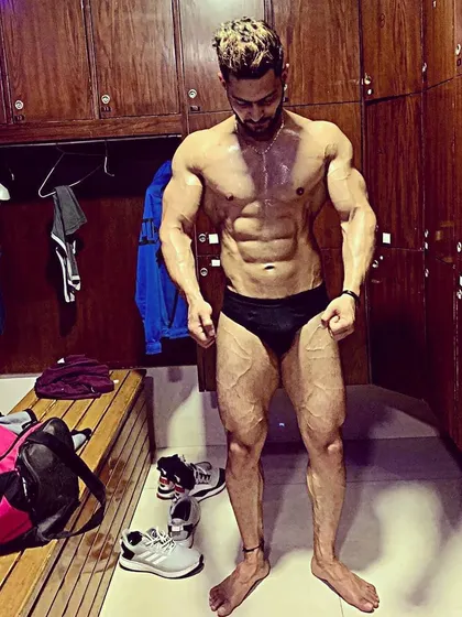In the locker room after a tough session. This is a real look at post-workout conditioning and the results of pushing your body to its limits.