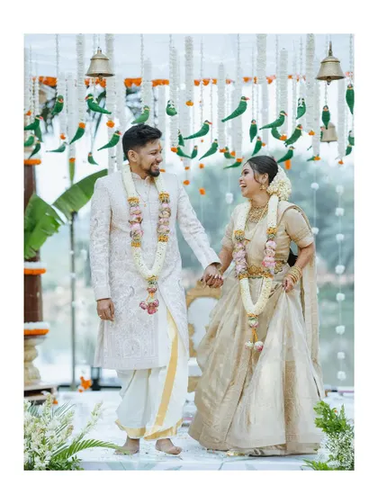 A beautiful portrait of the couple holding hands after their South Indian wedding ceremony, their happiness shining through.