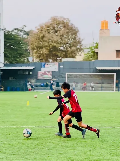 A typical Friday practice session involves a mix of skill development, tactical drills, and preparation for upcoming matches. Here, players work on their dribbling and control.