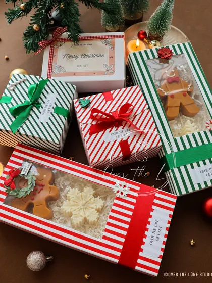 Getting into the festive spirit with my Christmas gift boxes. This set features a hand-painted gingerbread man and a delicate snowflake candle, all packed up and ready to bring some holiday cheer to your loved ones.