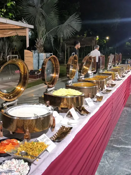 A view of our dinner buffet, including salads, raita, and multiple main courses. We ensure a balanced and complete menu for every meal we serve.