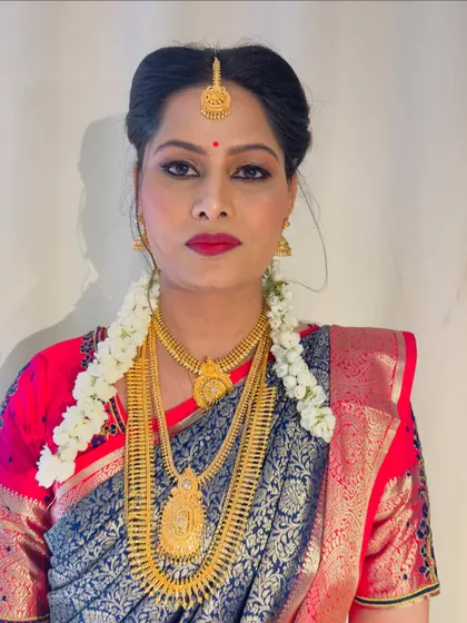 A portrait of Gulista looking directly at the camera, showcasing the symmetry and precision of her bridal makeup. Her confidence and happiness are what I strive for with every client.
