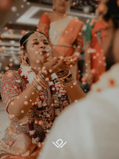 A playful ritual where the bride blows colorful balls towards the groom, a moment filled with laughter and fun.