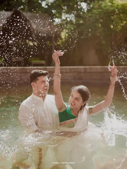 A splash of joy for Jayaram and Abirami during their playful water shoot. These moments of pure fun add so much energy and personality to a pre-wedding film.