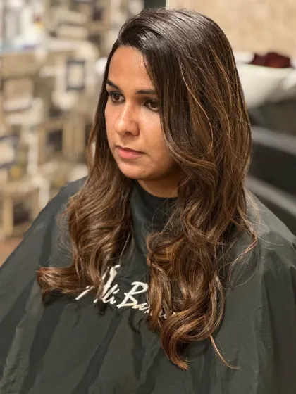 Two changes in one. We controlled frizz and added a beautiful, warm color for a complete hair makeover that is smooth, healthy, and stylish.