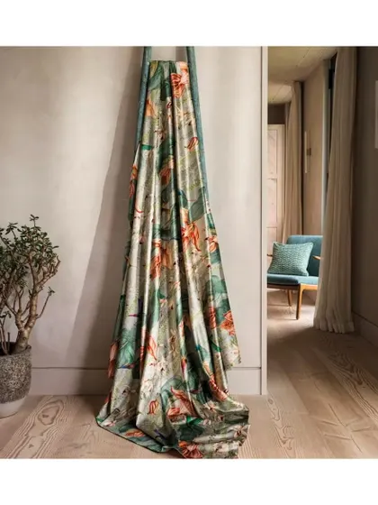Soft as a dream and rich as a masterpiece, this velvet fabric from Osborne & Little is adorned with elegant orchids. The deep, luxurious hues and plush texture create a vibrant symphony of color, making every detail come to life on this statement textile.