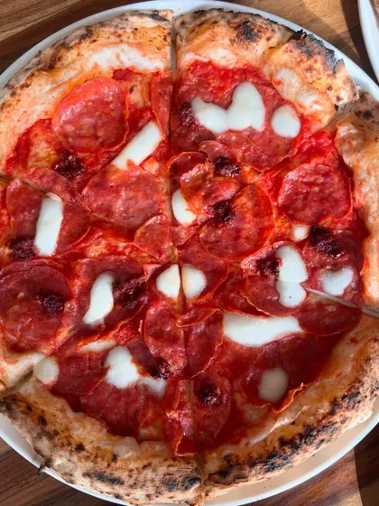 A top-down view of our spicy Nduja & Soppressata pizza. It's a flavour explosion.