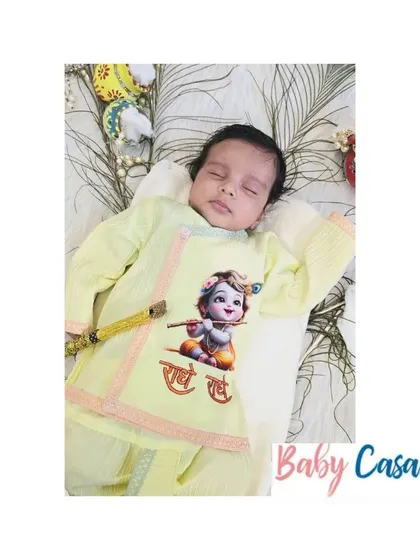 Welcome your little Kanha with love. This yellow printed dhoti and kurta set is a comfortable and traditional choice for his first Janmashtami puja.