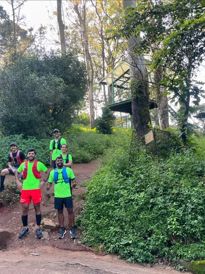 The team posing on the trail steps at Nandi Hills. Training here is essential for preparing for the elevation of ultra-marathons.