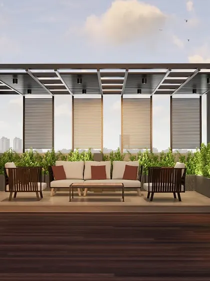 Where modern elegance meets biophilic design. This rooftop retreat at Kailash Apartments in Mangaluru blends a sleek pergola, warm wooden decking, and lush green walls to create the perfect urban escape.