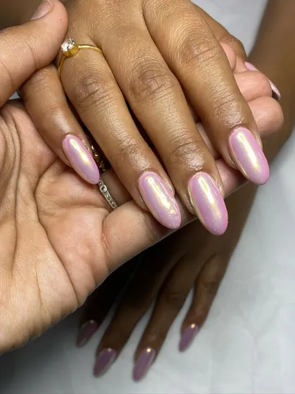 Another view of the unicorn chrome nails, held to showcase the color shift and shine.