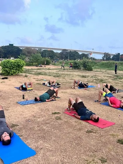 A wide shot of our Mahalaxmi Racecourse group working on glute bridges. The open space allows us to accommodate a large group while ensuring everyone has room to train comfortably.