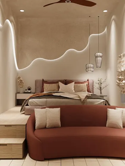 This bedroom features a multi-level design, with a raised platform for the bed and a cozy sofa area below.