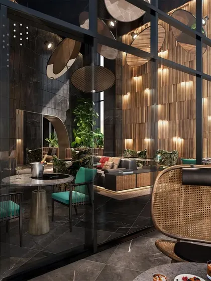 An executive lounge designed with a unique and sophisticated aesthetic. This view from the outside looking in showcases the layered design, with a bar area, comfortable seating nooks, and dramatic lighting.