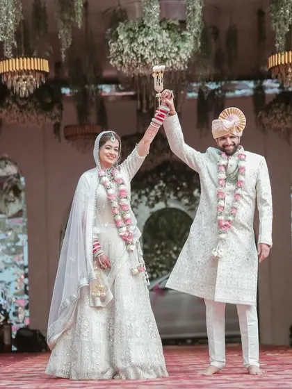 A triumphant pose after the wedding ceremony. This is a moment of pure celebration, and we make sure to capture it in all its glory.