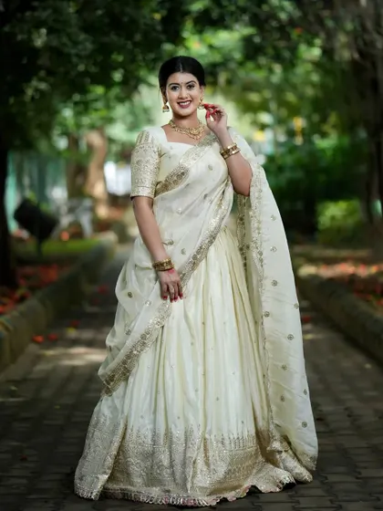 A full-length shot of the stunning custom white half saree, celebrating Maa Skandamata.