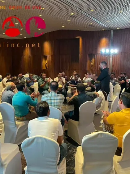 A bird's-eye view of a corporate session, showing the group's focus on the facilitator. This is where individual efforts merge into a collective success, a key lesson in teamwork.