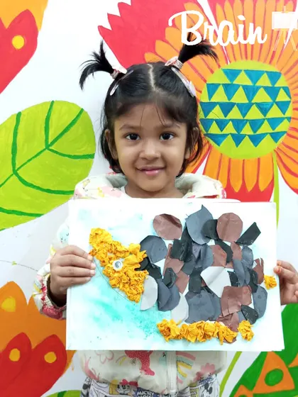 This collage was made by tearing and arranging different types of paper. It's a wonderful way for kids to explore textures and composition without worrying about drawing perfect lines.