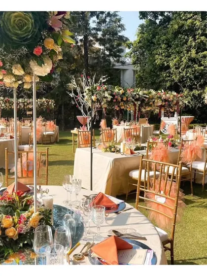 A beautiful peach-themed outdoor luncheon setup, demonstrating our versatility in creating stunning daytime events with colorful and fresh tablescapes.