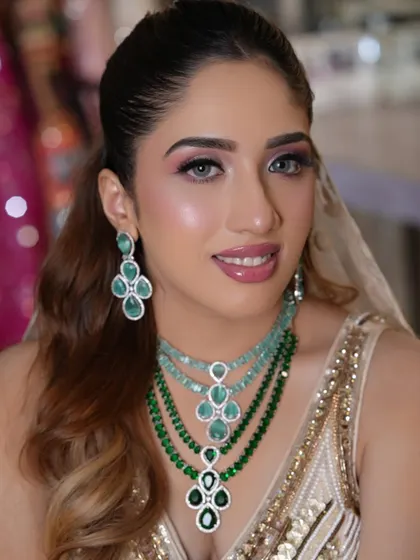 A happy and radiant shot from the portfolio. This look is all about bringing a bride's dream to life with soft, romantic glamour.