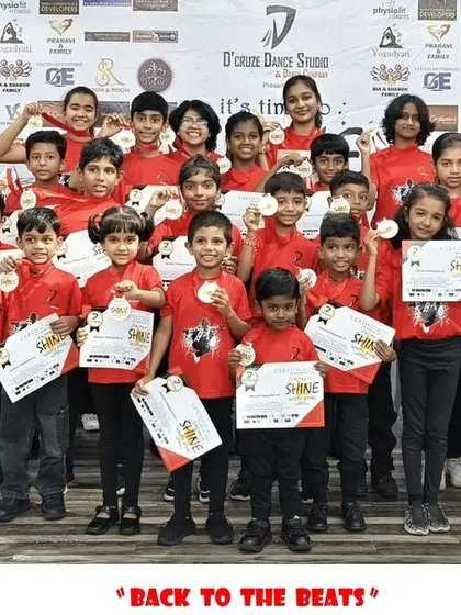 The entire group of participants from the "Back to the Beats" event with their awards.