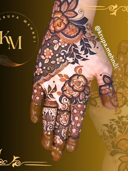 A fancy Dubai-style mehndi design with bold roses and delicate leafy vines. This is a great choice for parties, festivals, or for the modern bride.