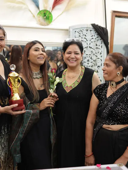 A happy, candid moment with my students and a trophy winner on graduation day.