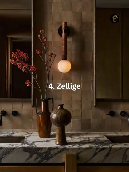 Zellige tiles, with their handmade texture and subtle color variations, are a beautiful way to incorporate brown. They add a layer of quiet luxury to this bathroom vanity backsplash.