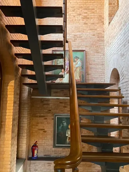 The new public staircase we introduced at the Sister Nivedita Museum. Crafted from steel and wood, its modern form is a deliberate counterpoint to the historic brick walls, creating a clear distinction between the original structure and our intervention.
