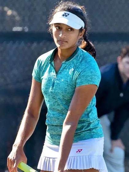Competing at the ITF W100 Charleston event. Playing at this level requires intense focus and preparation, as seen in these moments of on-court concentration and sportsmanship.