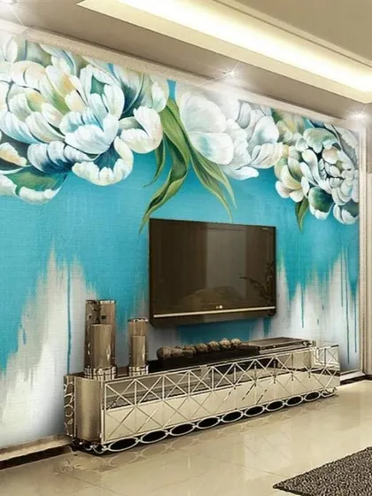 An idea for a bold floral wallpaper in a modern living room. The oversized white and blue flowers on a textured background make a powerful artistic statement.