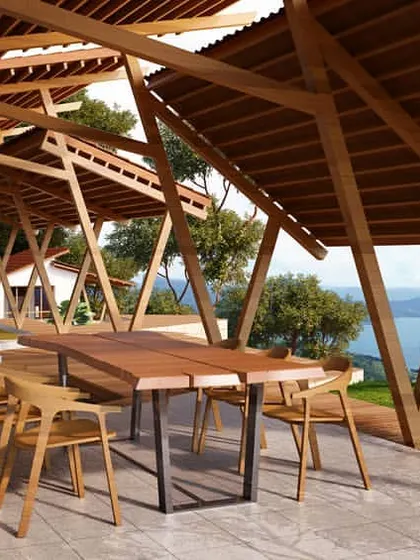 A residential project in Lonavala, featuring a covered outdoor dining area with an expansive view of Pavna Lake. The design utilizes a diagrid roof structure and natural wood to create a seamless connection between the built environment and the surrounding landscape.